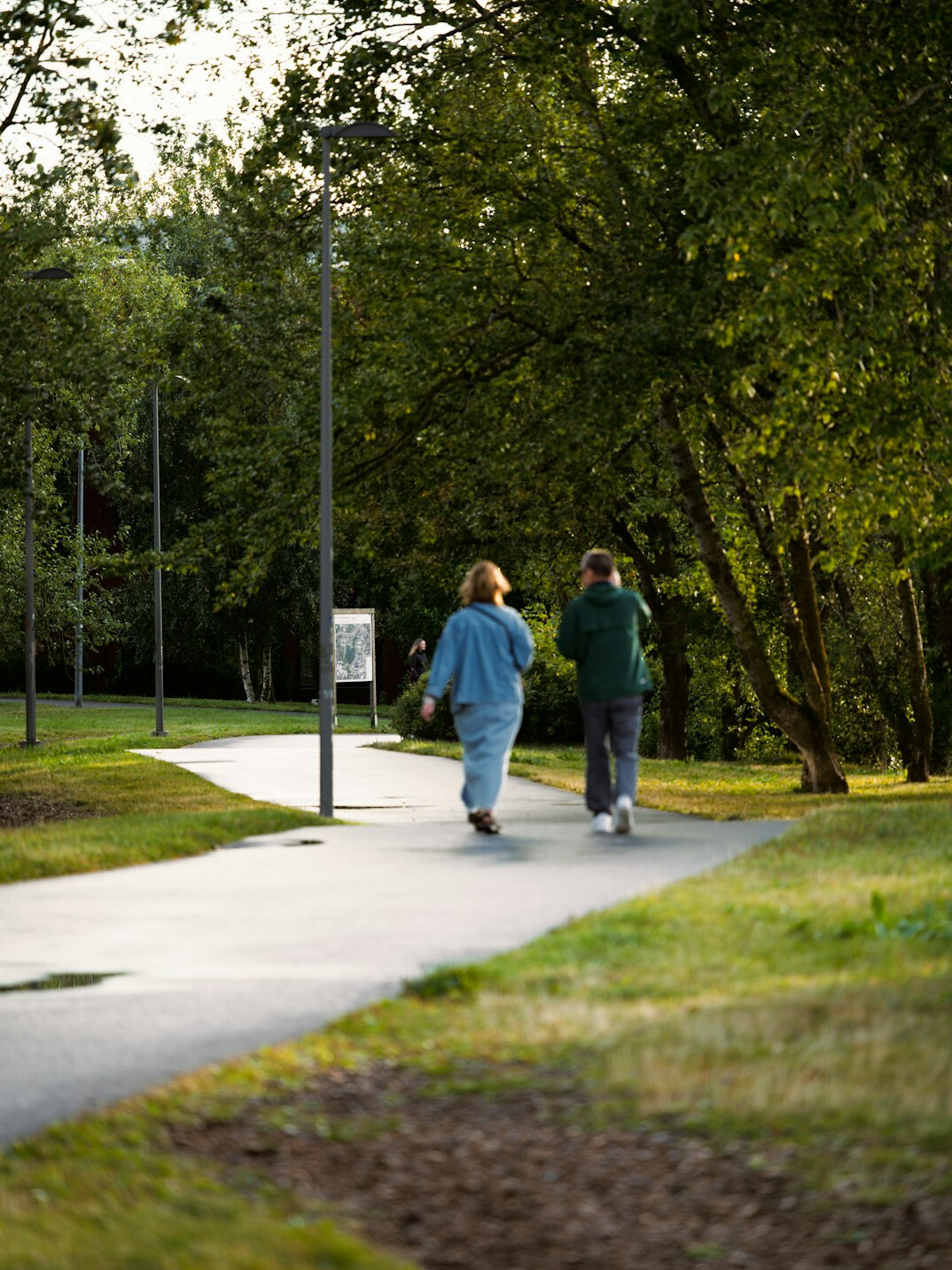 retired couple walking in park