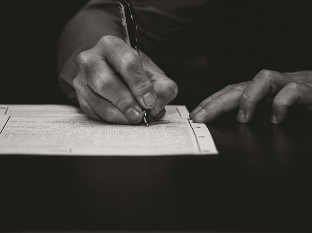 person signing insurance contract