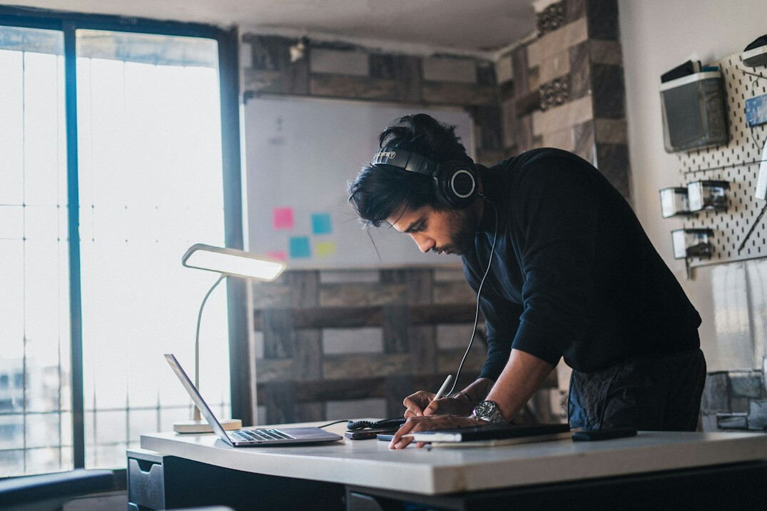 person calculating budget at desk